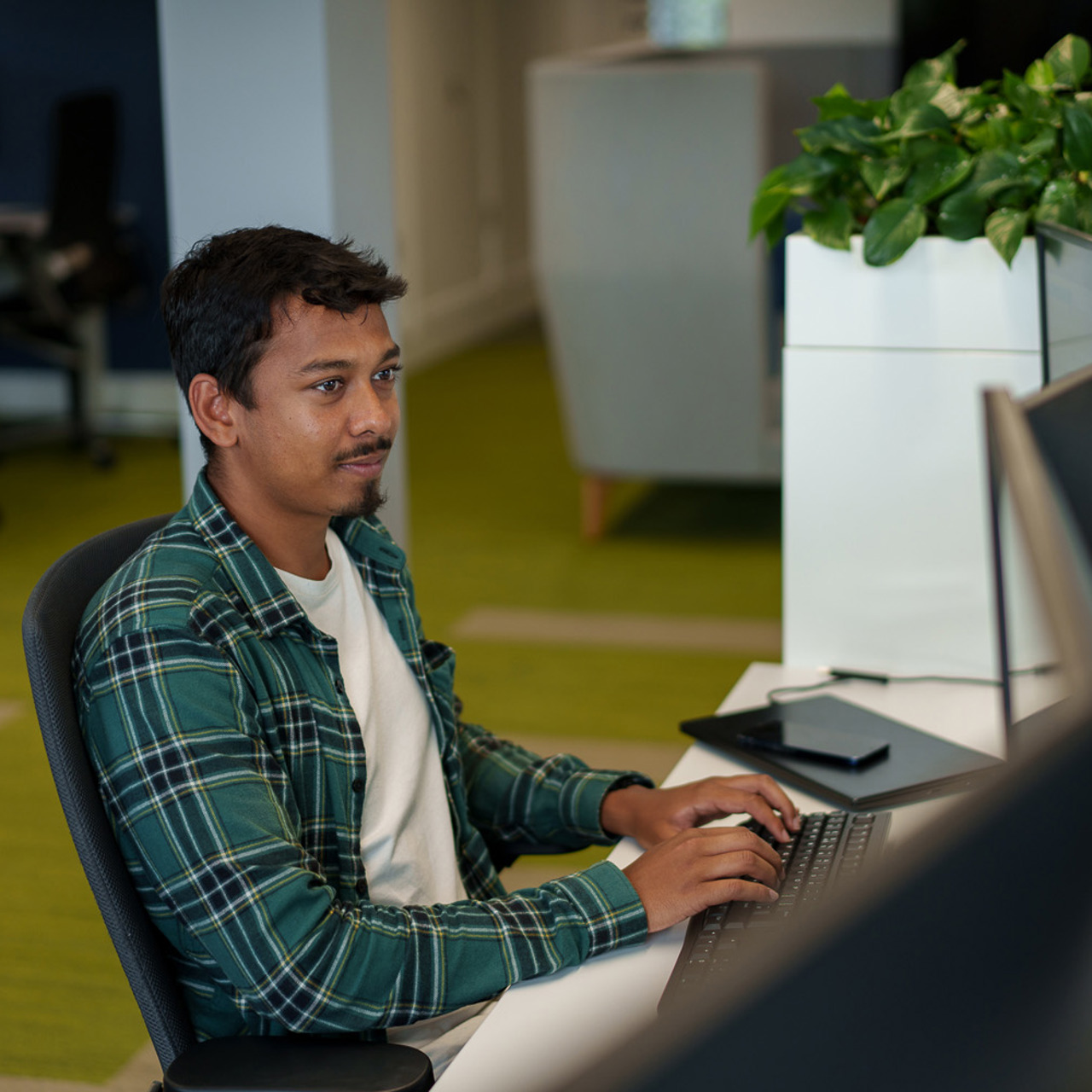 LCP employee sitting at desk in Winchester office