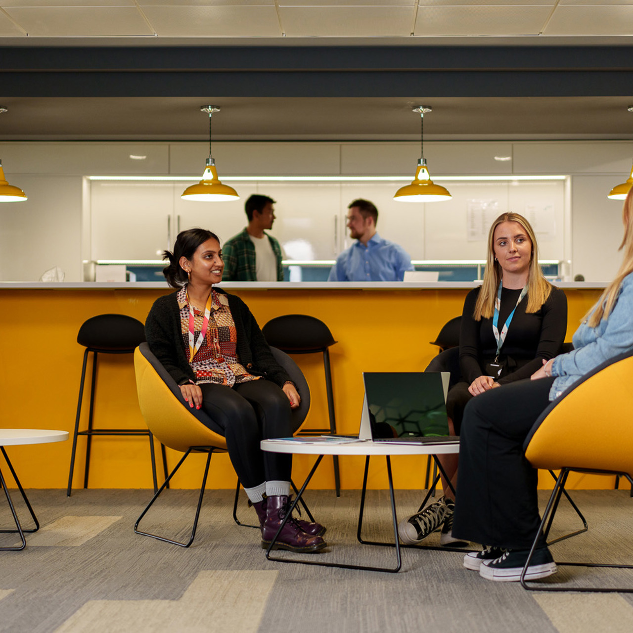 Three colleagues having an informal meeting